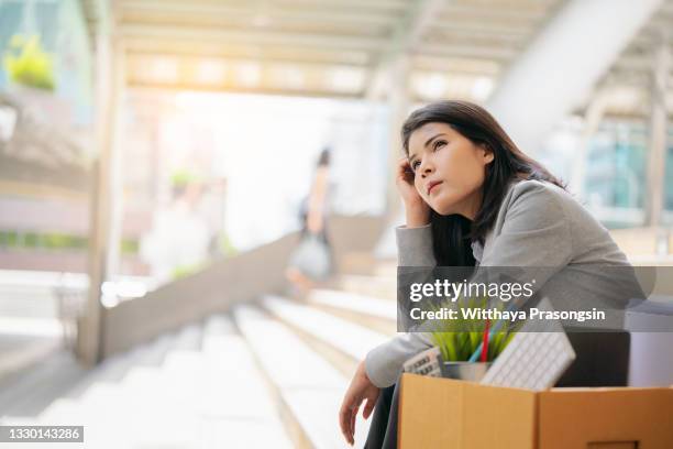 businesswoman got fired unemployed feeling stressed - unemployed marketing professional searches for a job stock pictures, royalty-free photos & images