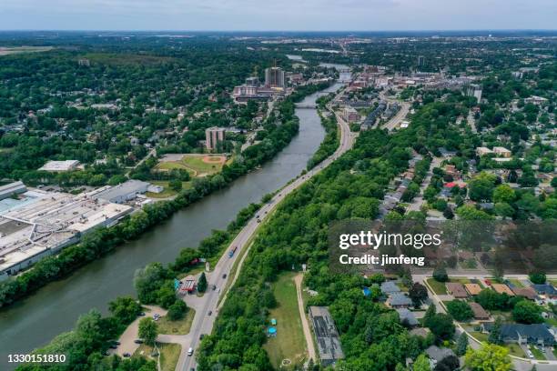 aerial grand river and cityscape in galt, cambridge, ontario, canada - kitchener ontario stockfoto's en -beelden