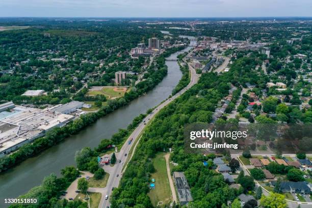 aerial grand river and cityscape in galt, cambridge, ontario, canada - ontario canada stockfoto's en -beelden