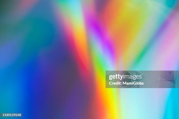 holographic paper reflects rainbow-colored light - hologramme photos et images de collection