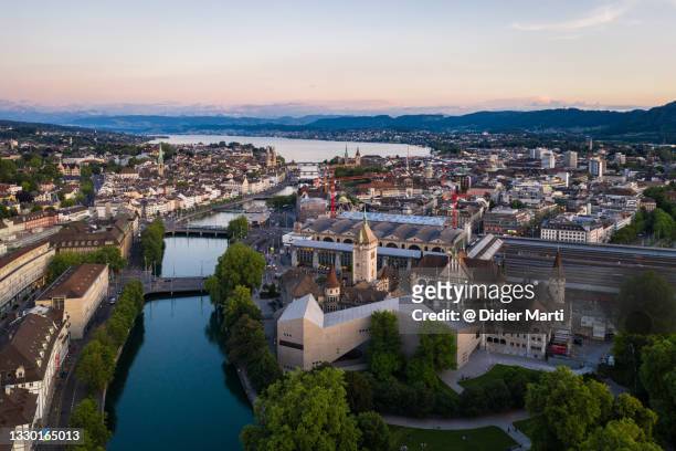 aerial view at dusk of the zurich city center in switzerland - zurich museum stock pictures, royalty-free photos & images
