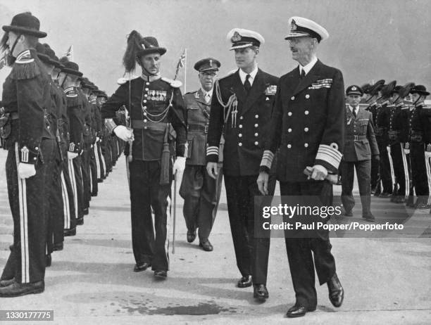 Prince Philip, Duke of Edinburgh and King Haakon VII of Norway , on right, inspect the company of honour from the King's guard upon Prince Philip's...