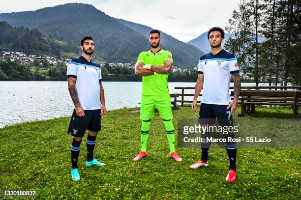Lazio players Danilo Cataldi, Thomas Strakosha and Felipe Anderson posing in the new away kit on July 23, 2021 in Auronzo di Cadore, Italy.
