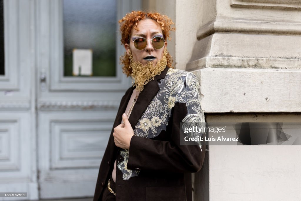 Non binary person posing in drag attire
