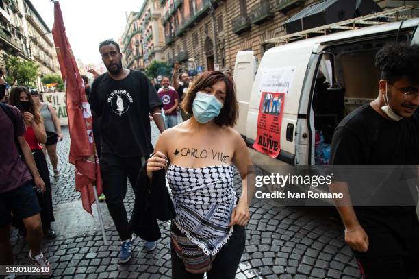 Girl shows on her body the words "Carlo vive" dedicated to the activist Carlo Giuliani who died in Genoa in 2001 during the No G20 protest on July...