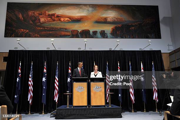 President Barack Obama smiles as he listens to Australian Prime Minister Julia Gillard during a Joint Media Conference on the first day of his 2-day...