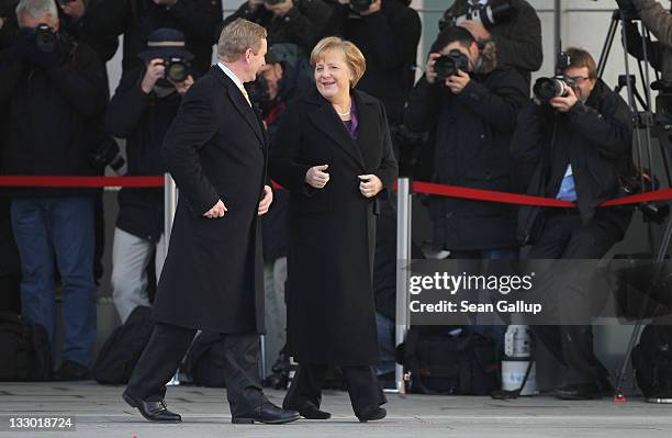 Irish Prime Minister Enda Kenny and German Chancellor Angela Merkel chat upon Kenny's arrival at the Chancellery on November 16, 2011 in Berlin,...