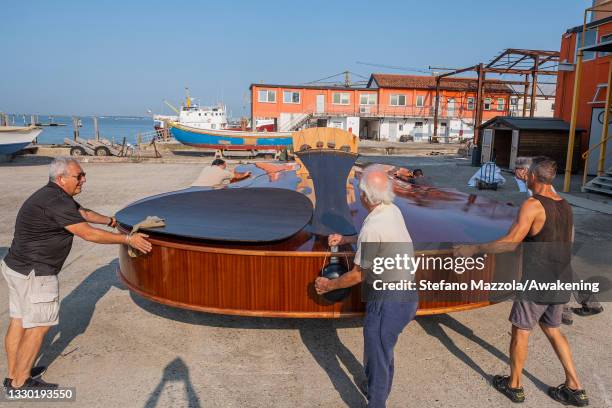 The violin boat is brought to the place where the presentation to the press on July 23, 2021 in Venice, Italy. The violin boat will be launched in...