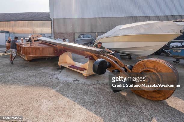 The violin boat is brought to the place where the presentation to the press on July 23, 2021 in Venice, Italy. The violin boat will be launched in...