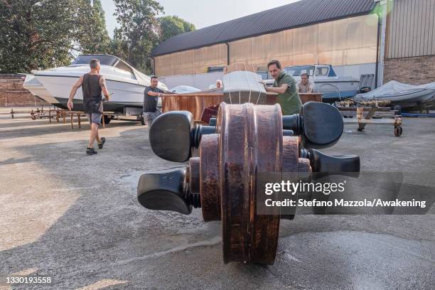 The violin boat is brought to the place where the presentation to the press on July 23, 2021 in Venice, Italy. The violin boat will be launched in...