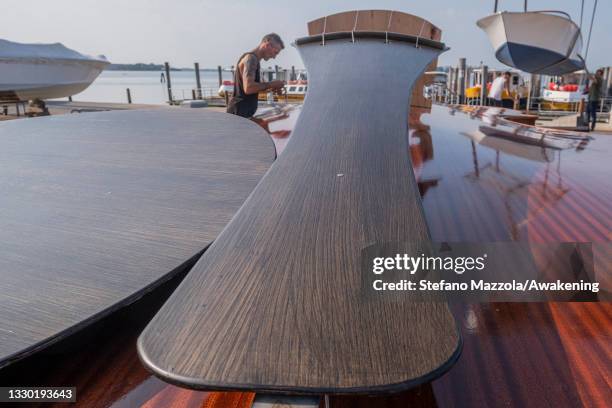 Builders finish preparing violin boat before press presentation on July 23, 2021 in Venice, Italy. The violin boat will be launched in September and...