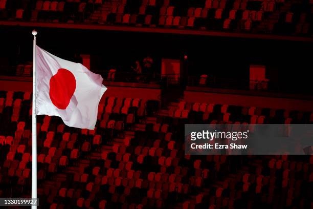 The Japan Flag is raised as the national anthem is sung during the Opening Ceremony of the Tokyo 2020 Olympic Games at Olympic Stadium on July 23,...