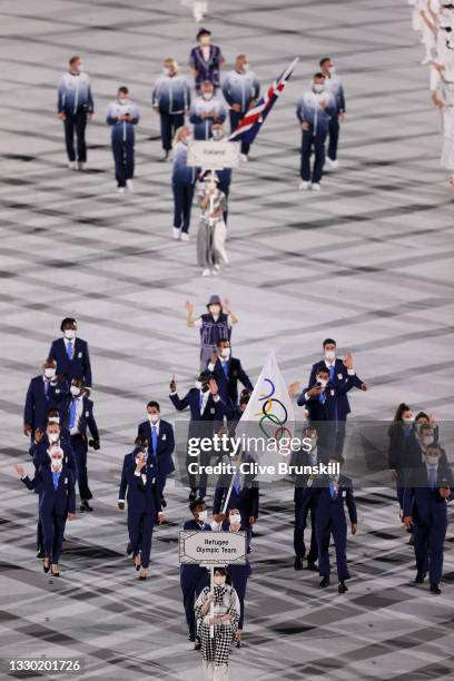 Flag bearers Yusra Mardini and Tachlowini Gabriyesos of The Refugee Olympic Team lead their team in during the Opening Ceremony of the Tokyo 2020...