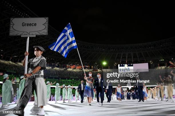 Flag bearers Anna Korakaki and Eleftherios Petrounias of Team Greece lead their team in during the Opening Ceremony of the Tokyo 2020 Olympic Games...