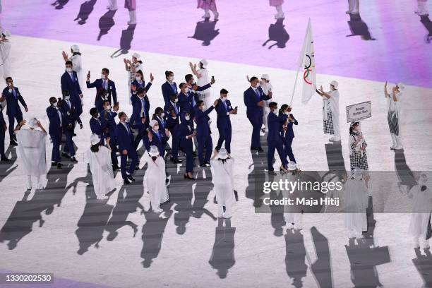 Flag bearers Yusra Mardini and Tachlowini Gabriyesos of the Refugee Olympic Team lead their team out during the Opening Ceremony of the Tokyo 2020...