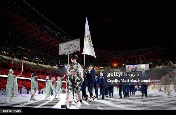 Flag bearers Yusra Mardini and Tachlowini Gabriyesos of The Refugee Olympic Team during the Opening Ceremony of the Tokyo 2020 Olympic Games at...