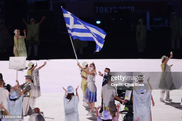 Flag bearers Anna Korakaki and Eleftherios Petrounias of Team Greece during the Opening Ceremony of the Tokyo 2020 Olympic Games at Olympic Stadium...