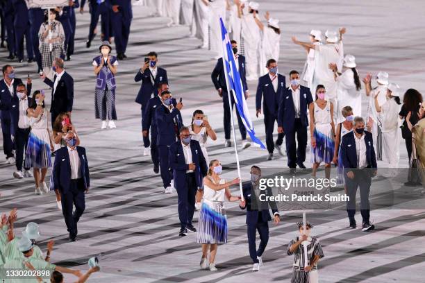 Flag bearers Anna Korakaki and Eleftherios Petrounias of Team Greece during the Opening Ceremony of the Tokyo 2020 Olympic Games at Olympic Stadium...