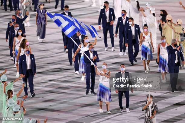 Flag bearers Anna Korakaki and Eleftherios Petrounias of Team Greece during the Opening Ceremony of the Tokyo 2020 Olympic Games at Olympic Stadium...