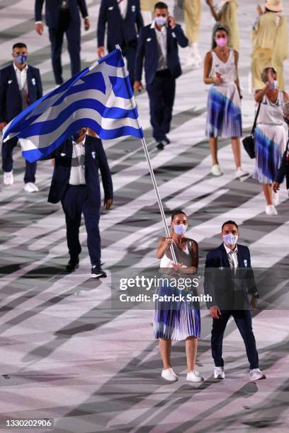 Flag bearers Anna Korakaki and Eleftherios Petrounias of Team Greece during the Opening Ceremony of the Tokyo 2020 Olympic Games at Olympic Stadium...