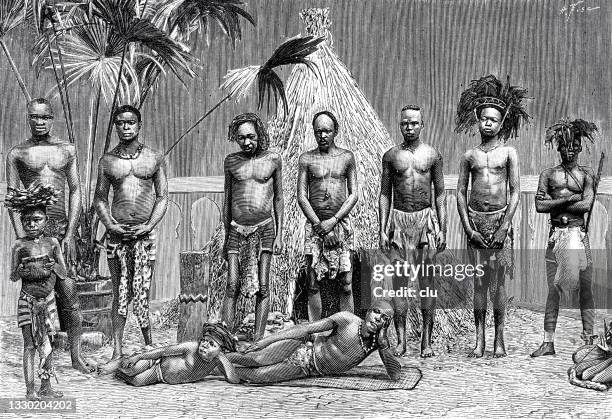 people from angola in a row in front of a straw hut, exposition universelle 1889 - ancient stock illustrations