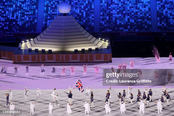 Flag bearers Hannah Mills and Mohamed Sbihi of Team Great Britain leads their team out during the Opening Ceremony of the Tokyo 2020 Olympic Games at...