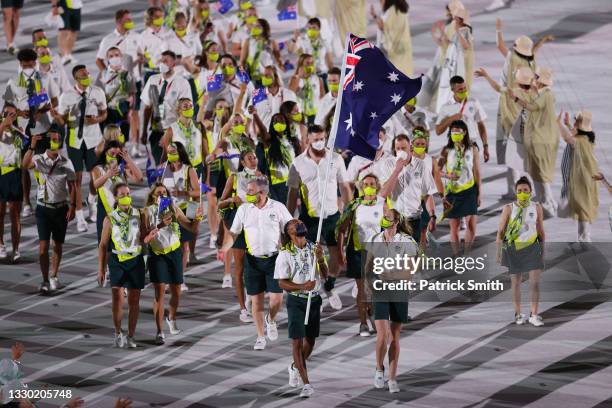 Flag bearers Cate Campbell and Patty Mills of Team Australia lead their team in during the Opening Ceremony of the Tokyo 2020 Olympic Games at...