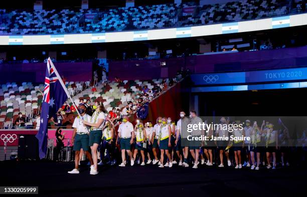 Flag bearers Cate Campbell and Patty Mills of Team Australia lead their team out during the Opening Ceremony of the Tokyo 2020 Olympic Games at...