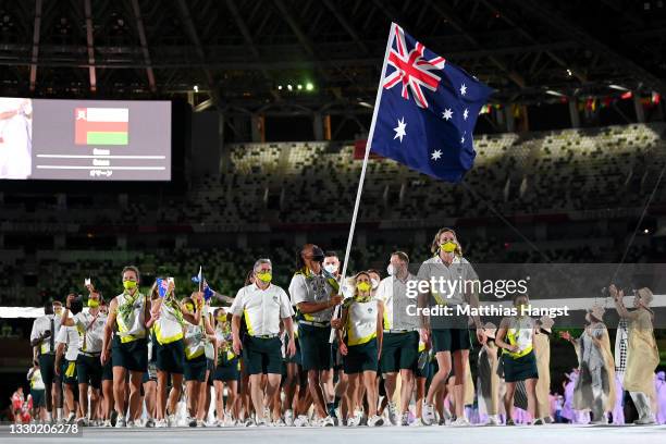 Flag bearers Cate Campbell and Patty Mills of Team Australia lead their team out during the Opening Ceremony of the Tokyo 2020 Olympic Games at...