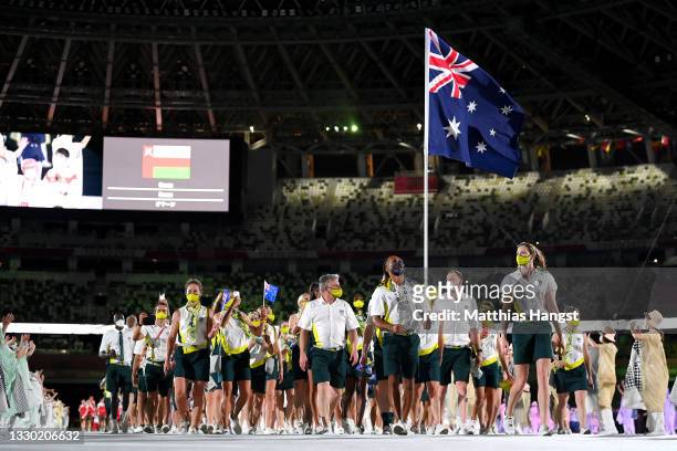 Flag bearers Cate Campbell and Patty Mills of Team Australia lead their team out during the Opening Ceremony of the Tokyo 2020 Olympic Games at...