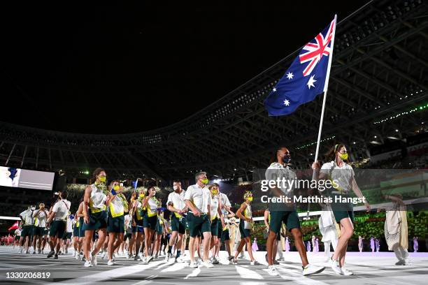 Flag bearers Cate Campbell and Patty Mills of Team Australia lead their team out during the Opening Ceremony of the Tokyo 2020 Olympic Games at...