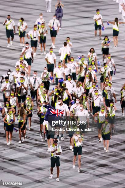 Flag bearers Cate Campbell and Patty Mills of Team Australia lead their team in during the Opening Ceremony of the Tokyo 2020 Olympic Games at...