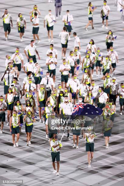 Flag bearers Cate Campbell and Patty Mills of Team Australia lead their team in during the Opening Ceremony of the Tokyo 2020 Olympic Games at...