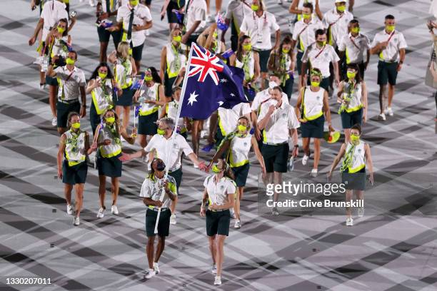 Flag bearers Cate Campbell and Patty Mills of Team Australia lead their team in during the Opening Ceremony of the Tokyo 2020 Olympic Games at...