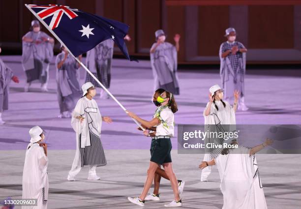 Flag bearers Cate Campbell and Patty Mills of Team Australia lead their team in during the Opening Ceremony of the Tokyo 2020 Olympic Games at...