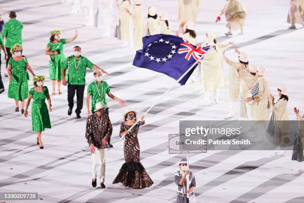 Flag bearers Kirsten Andrea Fisher-Marsters and Wesley Tikiariki Roberts of Team Cook Islands during the Opening Ceremony of the Tokyo 2020 Olympic...