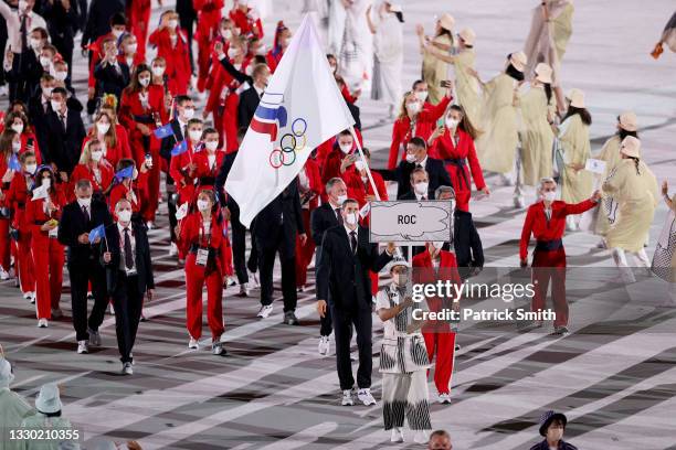 Flag bearers Sofya Velikaya and Maxim Mikhaylov of Team ROC lead their team in during the Opening Ceremony of the Tokyo 2020 Olympic Games at Olympic...