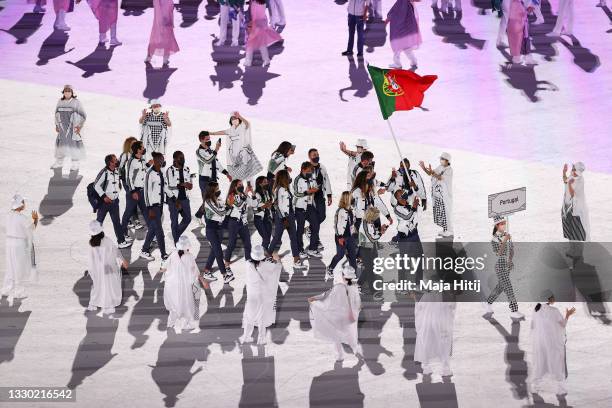 Flag bearers Telma Monteiro and Nelson Evora of Team Portugal during the Opening Ceremony of the Tokyo 2020 Olympic Games at Olympic Stadium on July...