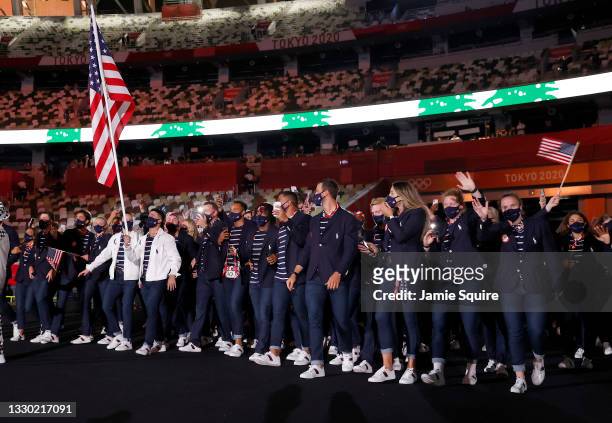Flag bearers Sue Bird and Eddy Alvarez of Team United States lead their team out during the Opening Ceremony of the Tokyo 2020 Olympic Games at...