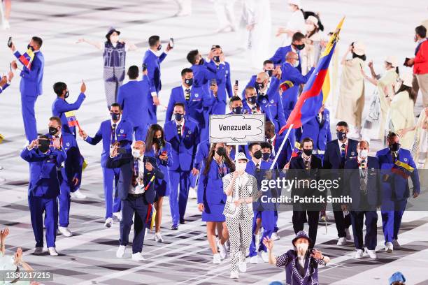 Flag bearers Karen Leon and Antonio Jose Diaz Fernandez of Team Venezuela during the Opening Ceremony of the Tokyo 2020 Olympic Games at Olympic...