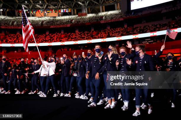 Flag bearers Sue Bird and Eddy Alvarez of Team United States lead their team out during the Opening Ceremony of the Tokyo 2020 Olympic Games at...