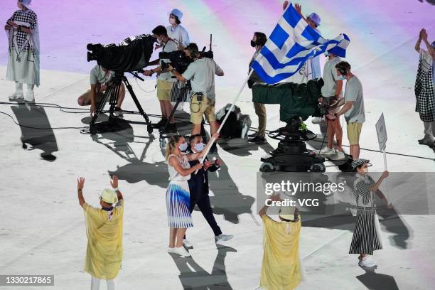 Flag bearers Anna Korakaki and Eleftherios Petrounias of Team Greece take part in the Parade of Nations during the Opening Ceremony of the Tokyo 2020...