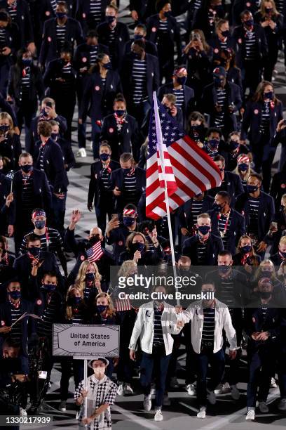 Flag bearers Sue Bird and Eddy Alvarez of Team United States lead their team out during the Opening Ceremony of the Tokyo 2020 Olympic Games at...