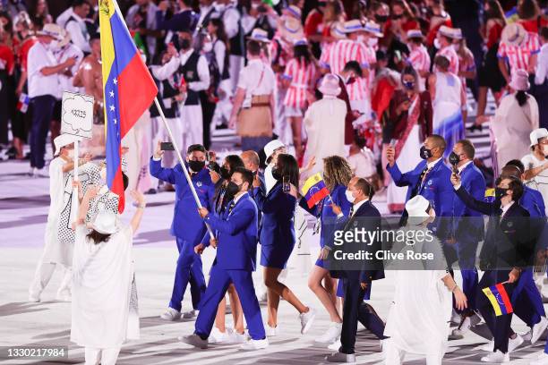 Flag bearers Karen Leon and Antonio Jose Diaz Fernandez of Team Venezuela during the Opening Ceremony of the Tokyo 2020 Olympic Games at Olympic...