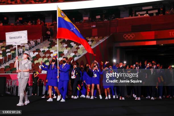 Flag bearers Karen Leon and Antonio Jose Diaz Fernandez of Team Venezuela during the Opening Ceremony of the Tokyo 2020 Olympic Games at Olympic...