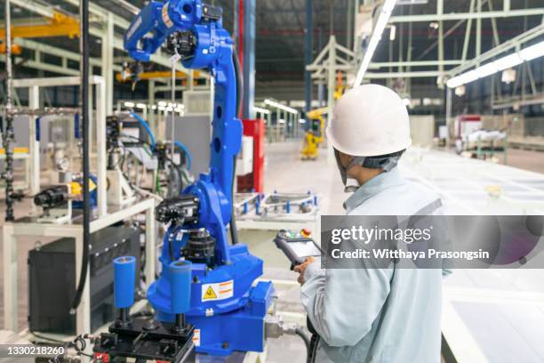 engineer hand using tablet, heavy automation robot arm machine in smart factory industrial - auto cad stock pictures, royalty-free photos & images