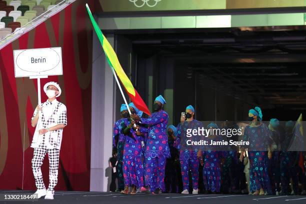 Flag bearers Nafissath Radji and Privel Hinkati of Team Benin during the Opening Ceremony of the Tokyo 2020 Olympic Games at Olympic Stadium on July...