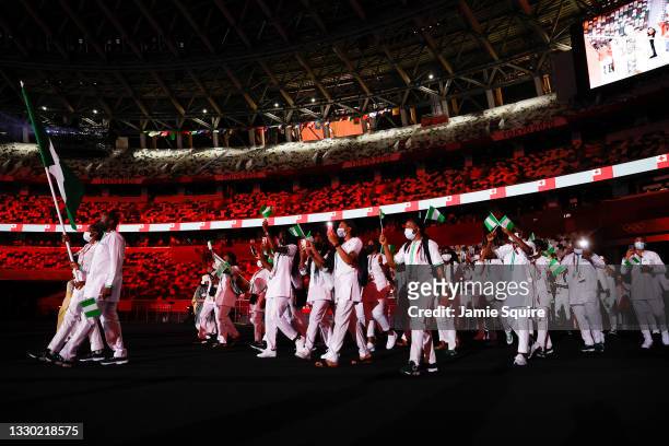 Flag bearers Roukaya Moussa Mahamane and Abdoul Razak Issoufou Alfaga of Team Nigeria during the Opening Ceremony of the Tokyo 2020 Olympic Games at...