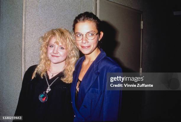 American actress Tina Yothers, wearing a black top with necklaces and a leather patch with a map of Africa in the colours of the Pan African...