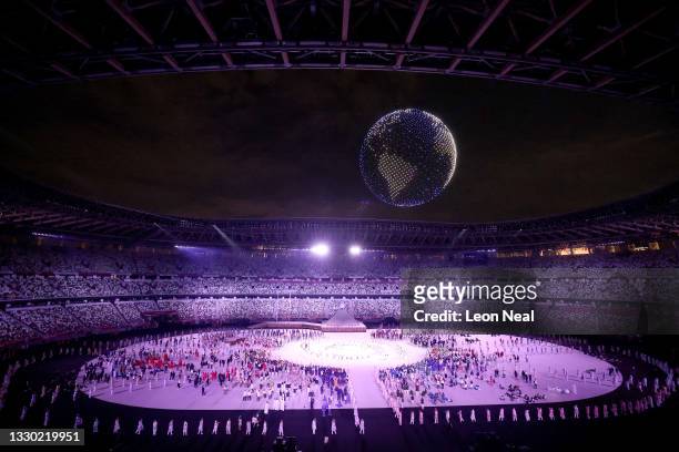 Drone display is seen over the top of the stadium during the Opening Ceremony of the Tokyo 2020 Olympic Games at Olympic Stadium on July 23, 2021 in...
